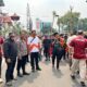 Bhabinkamtibmas Pantau Giat Festival KORMI dan Lomba Dayung di Kali Ciliwung Pasar Baru